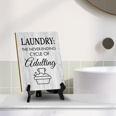 Signs ByLITA Laundry: The never-ending cycle of adulting Table Sign with Acrylic Stand (6x8“)
