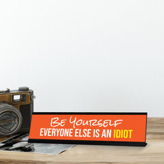 Be Yourself Everyone Else Is An Idiot, Orange Black Frame, Desk Sign (2x8“)