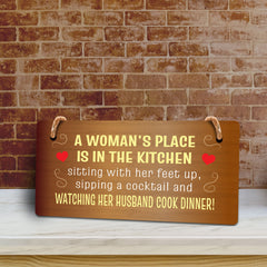 A Woman's Place Is In The Kitchen Sitting With Her Feet Up, Sipping A Cocktail And Watching Her Husband Cook Dinner! & Fun 5x10 Hanging Plus Wall or Door Sign