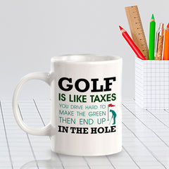 Signs ByLITA Golf Is Like Taxes; You Drive Hard To Make The Green Then End Up In The Hole 11oz Plastic/Ceramic Coffee Mug