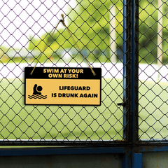 Swim At Your Own Risk! Lifeguard Is Drunk Again 5" x 10" Hanging Wall or Door Sign | Safety Signs