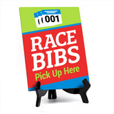 Signs ByLITA Race Bibs: Pick Up Here Table Sign with Acrylic Stand (6x8“)