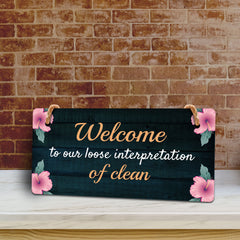 Welcome To Our Loose Interpretation Of Clean 5x10 Hanging Plus Wall or Door Sign | Funny Home Decor