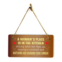 A Woman's Place Is In The Kitchen Sitting With Her Feet Up, Sipping A Cocktail And Watching Her Husband Cook Dinner! & Fun 5x10 Hanging Plus Wall or Door Sign