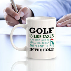 Signs ByLITA Golf Is Like Taxes; You Drive Hard To Make The Green Then End Up In The Hole 11oz Plastic/Ceramic Coffee Mug