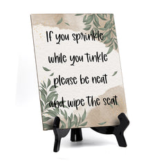 If You Sprinkle While You Tinkle Please Be Neat And Wipe The Seat Table Sign with Green Leaves Design (6 x 8")