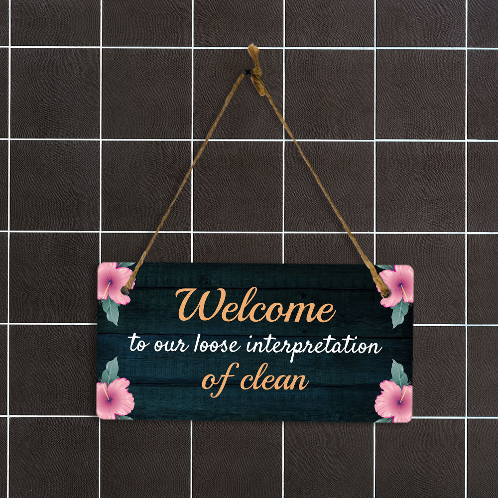 Welcome To Our Loose Interpretation Of Clean 5x10 Hanging Plus Wall or Door Sign | Funny Home Decor