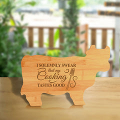 Designs ByLITA I Solemnly Swear That My Cooking Tastes Good 14.75 x 9.75" Cow Shape Cutting Board | Funny Kitchen Chopping Board