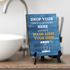 Signs ByLITA Drop your dirty laundry here, and we'll wash away your sins! Table Sign With Acrylic Stand (6x8“)