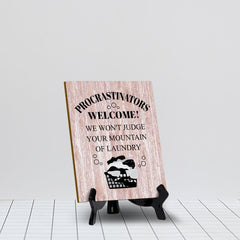 Signs ByLITA Procrastinators welcome! We won't judge your mountain of laundry Table Sign with Acrylic Stand (6x8“)