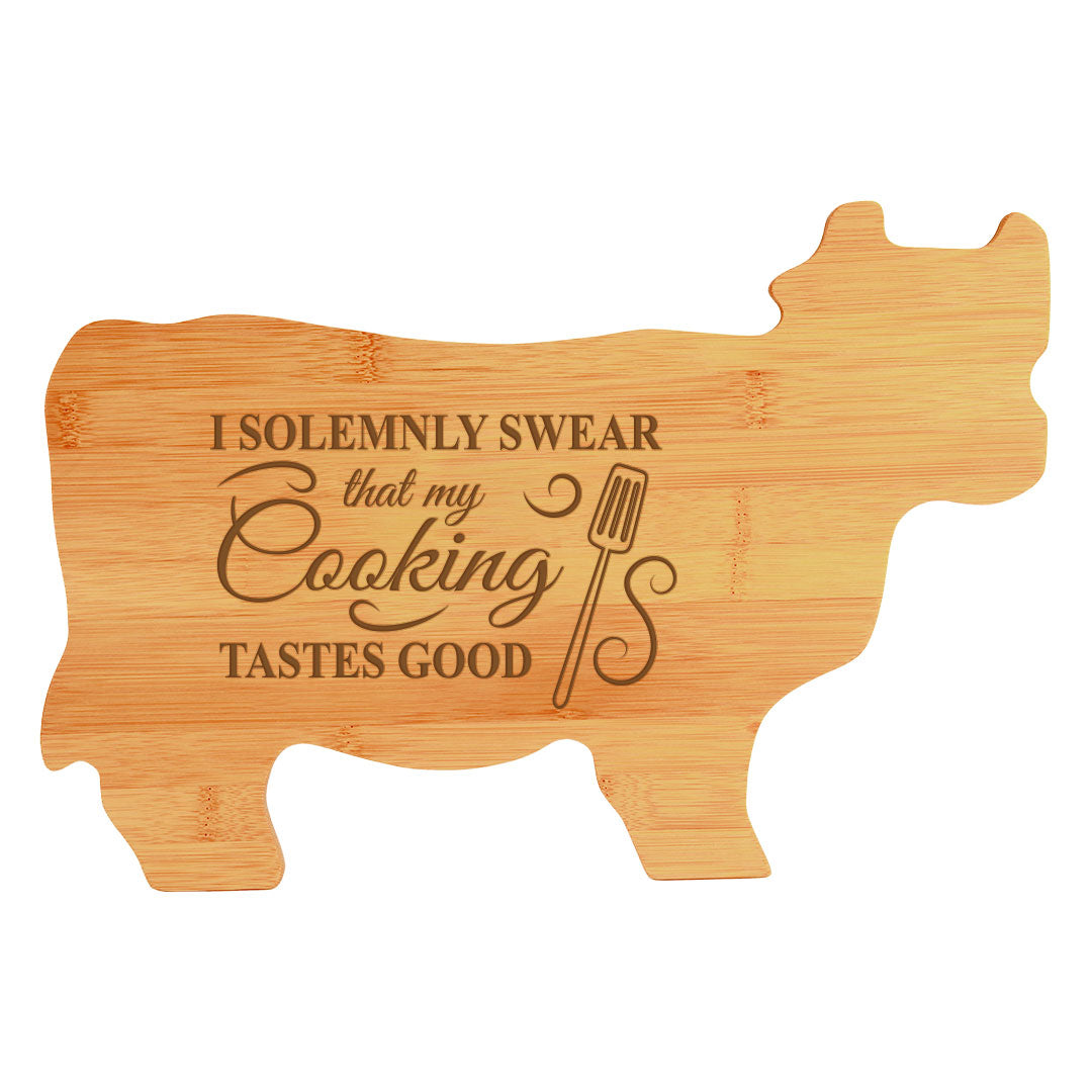 Designs ByLITA I Solemnly Swear That My Cooking Tastes Good 14.75 x 9.75" Cow Shape Cutting Board | Funny Kitchen Chopping Board
