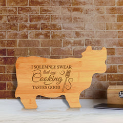 Designs ByLITA I Solemnly Swear That My Cooking Tastes Good 14.75 x 9.75" Cow Shape Cutting Board | Funny Kitchen Chopping Board