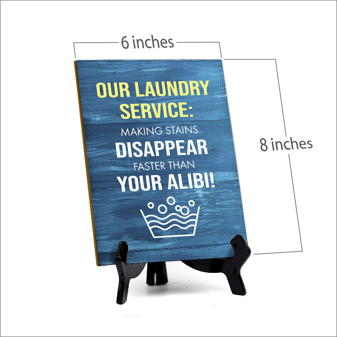 Signs ByLITA Our laundry service: Making stains disappear faster than your alibi! Table Sign with Acrylic Stand (6x8“)