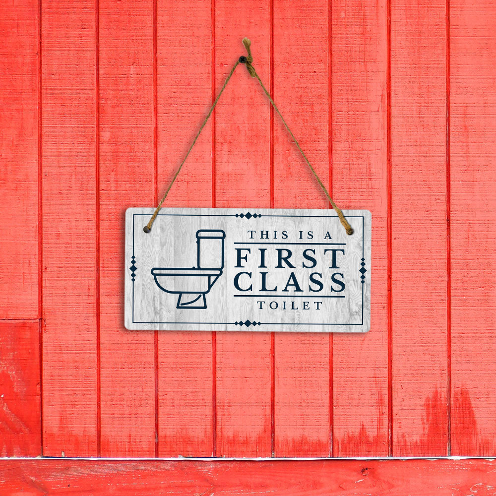 This is a First-Class Toilet 5x10 Hanging Wall or Door Sign | Warm Welcoming Signage For Homes