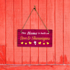 This Home Is Built On Love & Shenanigans 10x5 Hanging Plus Wall or Door Sign | Family Home Decor