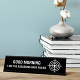 Good Morning I See The Assassins Have Failed Desk Sign, novelty nameplate (2 x 8")