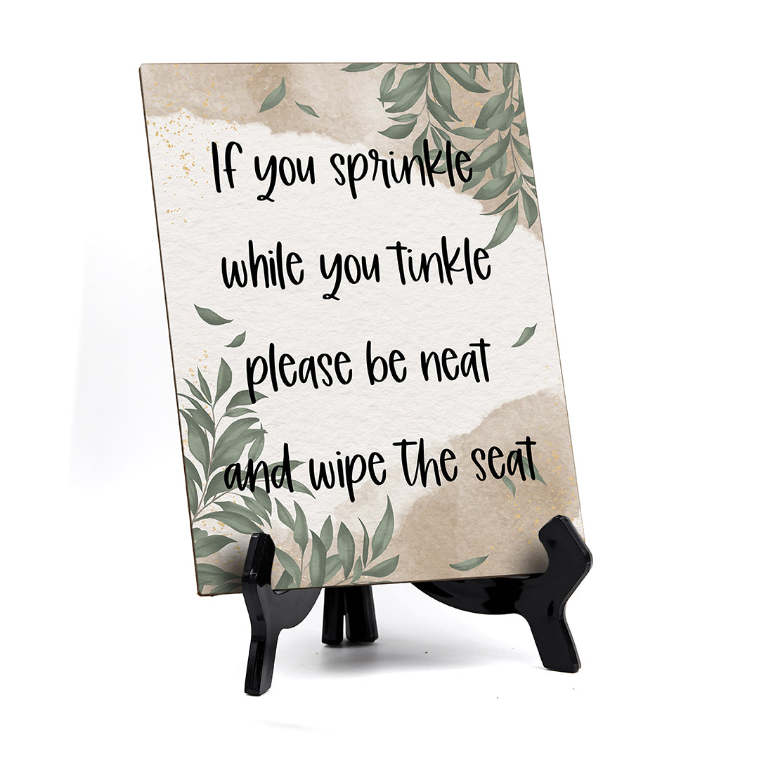 If You Sprinkle While You Tinkle Please Be Neat And Wipe The Seat Table Sign with Green Leaves Design (6 x 8")